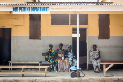 Pregnant women wait outside a clinic