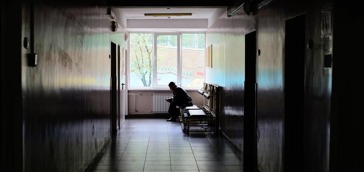 Photo of Ukrainian man sitting in hospital corridor